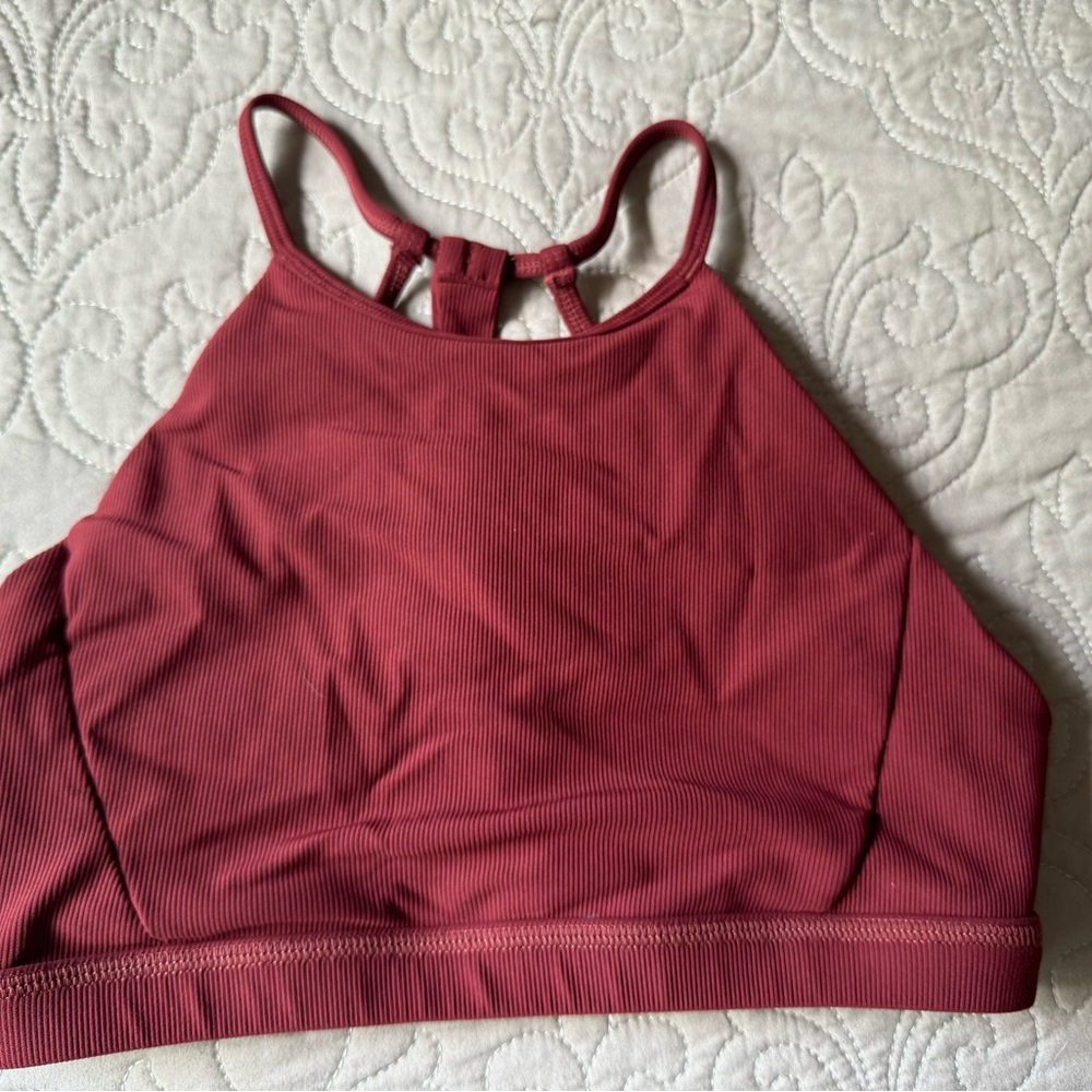 Born Primitive. Rust/burgandy color.